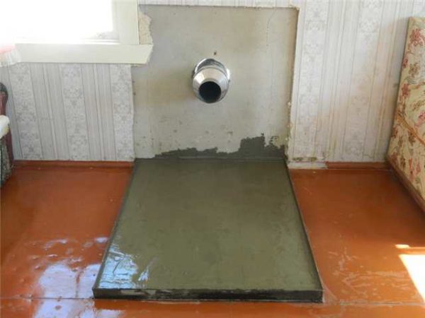 Préparation du site pour l'installation du four et du PPU installé dans le mur avec un morceau de tuyau