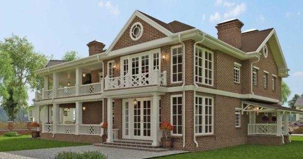 Grande maison en brique de deux étages avec deux terrasses ouvertes avec des éléments Art nouveau